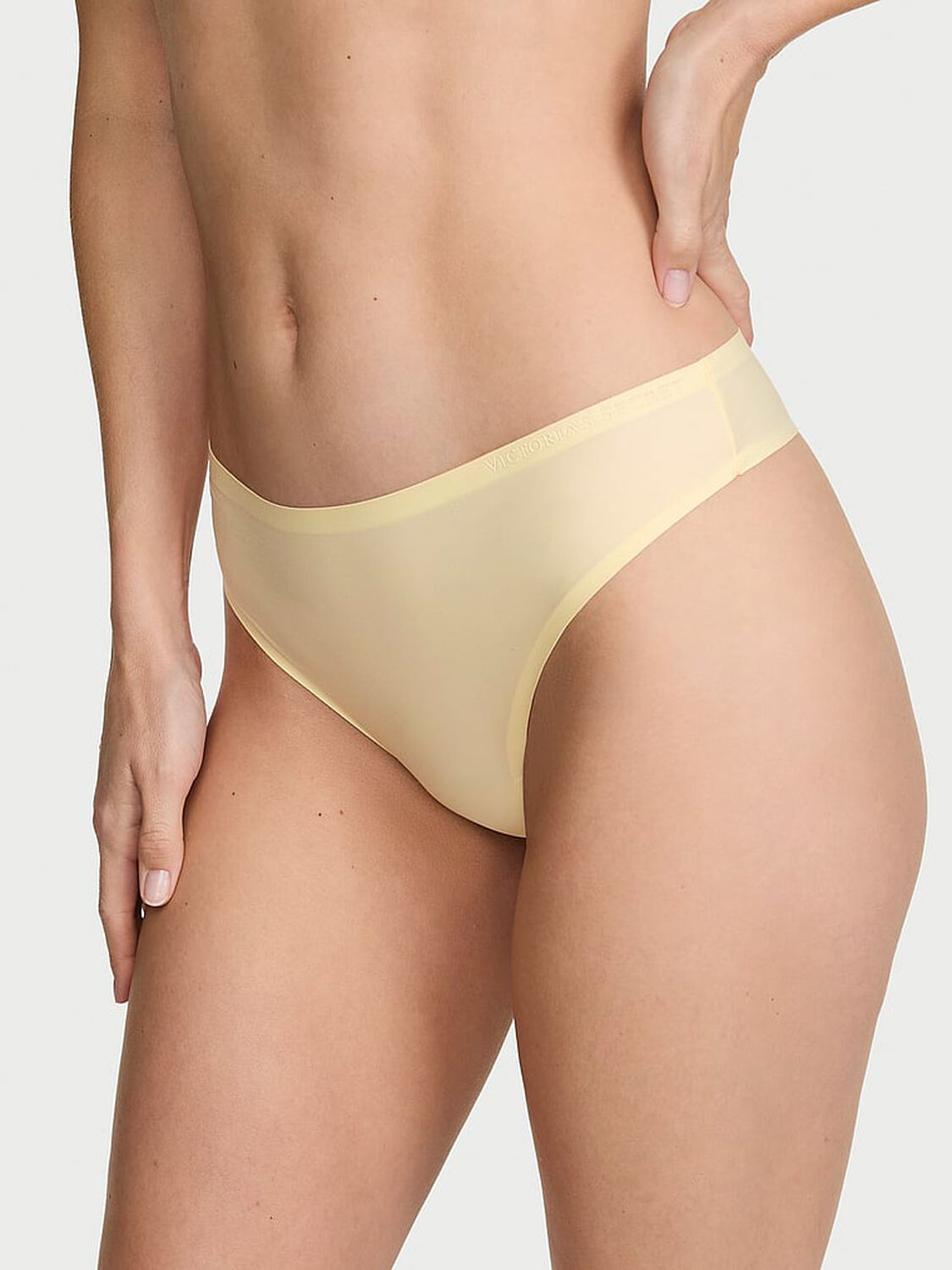 vs Body By Victoria Body by Victoria Flex Mid-Rise Thong Panty Sunny Honey 1 of 3 